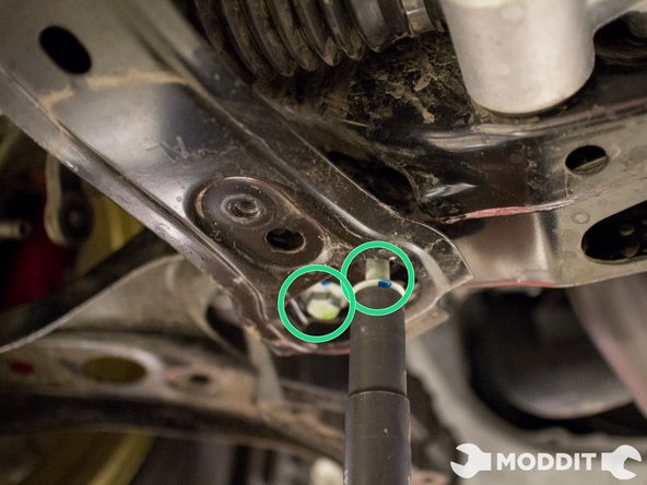 Once you have removed the plastic clips securing the splash shields remove the two brackets securing the sway bar to the front sub-frame and the chassis.