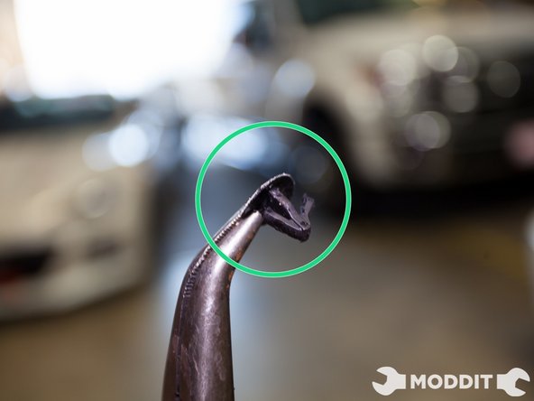 Here is a closer look at one of the clips covering the pre-drilled holes from the factory.As you can see from the design they might prove tough to take out.