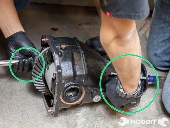 At some point doing this becomes very hard so with the help of a friend have him or her place a metal screwdriver through the pinion wheel (the part that connects to the driveshaft) and use that leverage to tighten the LSD ring all the way up to the desired torque specs. Once finished you are ready to perform some final measurements.