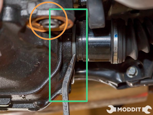 Next, Pry the axles off the differential. You want to do this now as it is easier when the front ear bolts and rear bushing bolts are in. Make sure to pry it at the correct location as noted in the picture. If you pry the shield it will break.