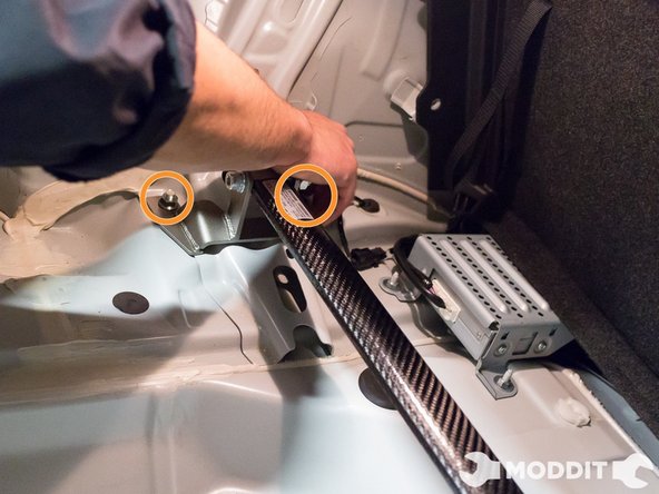 Once the bar is settled in, go ahead and carefully thread on the nuts on the strut mounts.