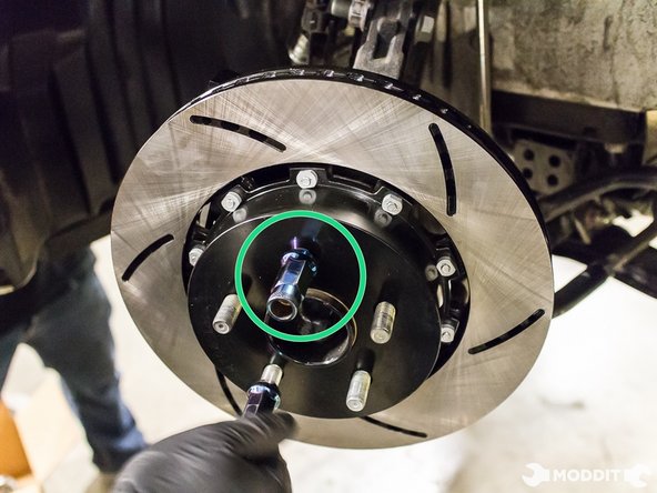 Clean brake pad with brake cleaner spray just in case there is oil from assembly.