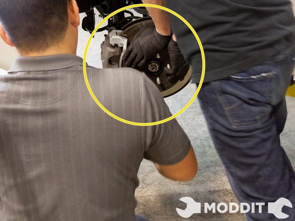 We decided to use a pry bar and pried from the front of the lower control arm through to the sway bar.