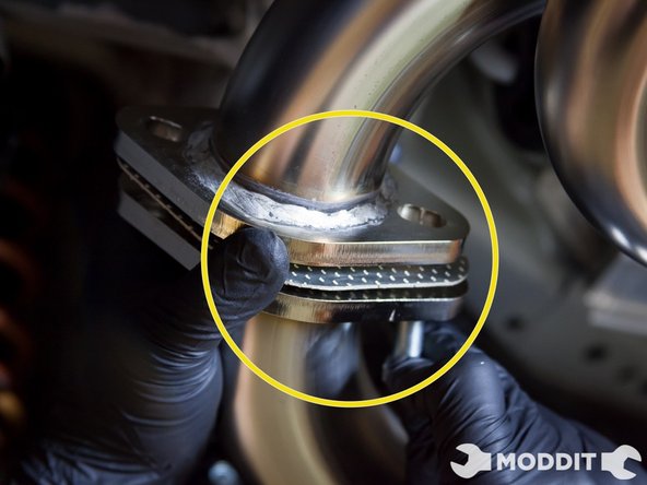 Install the bolt with head of the bolt toward the rear of the car. It will be easier to take out later.