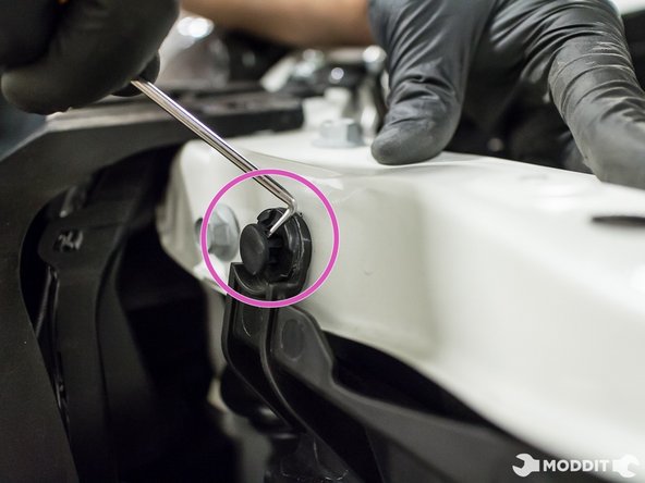 Remove the six plastic retaining clips securing the air diverter panel.