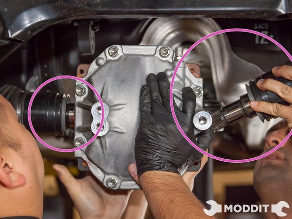 Then move on to loosen the right bolt holding up the differential ear.