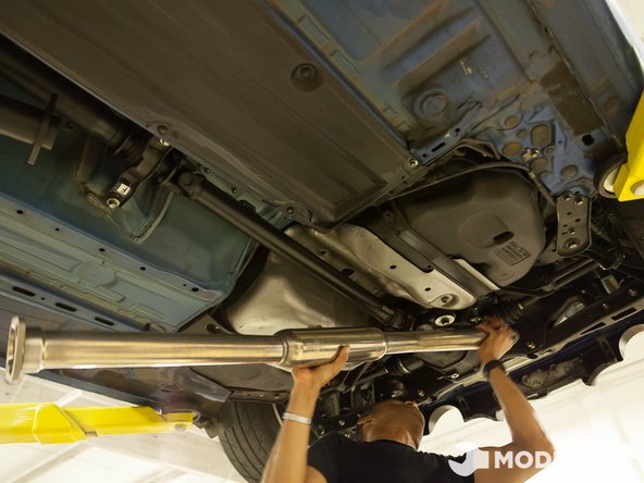 Position the mid-pipe in the stock location