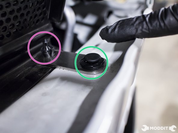 Using two factory plastic clips, attach the Perrin supplied support bracket to the diverter plate from the bottom.