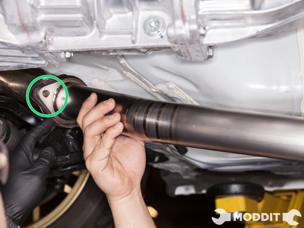 Utilizing factory hardware to overpipe, secure but do not tighten the front section of the tomei front pipe.