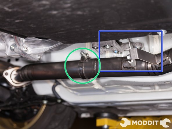 Slip a T-bolt clamp on the rear section with the threaded portion facing up and the head of the tightening bolt facing the driver side.