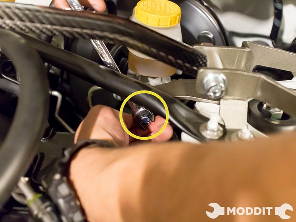 After its lightly screwed onto the bar, go ahead and tighten the stopper to where it touches the brake master cylinder. You would want them to touch, that way the BMC brace will actually do what it is designed to do.