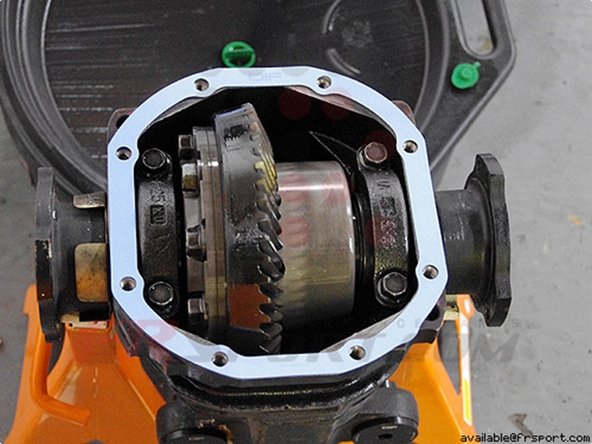 Once the fluid is drained, you can remove the 8 bolts holding the differential cover to the differential.