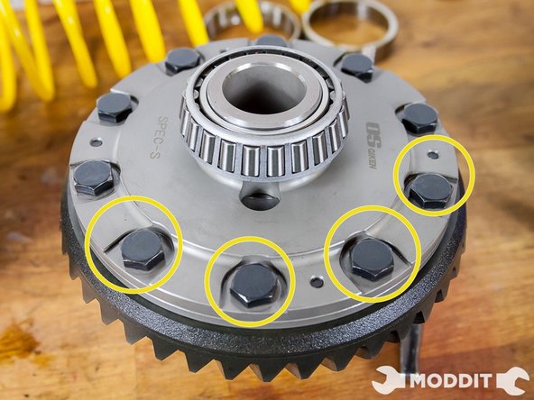 After all the bolts are coated with Thread Locker continue securing the rest of the bolts to the LSD Ring. Once all the bolts are in you will have to then tighten them at a temporary torque level. We used about 41 lbs of torques to tighten the ring before we put the whole differential back in.