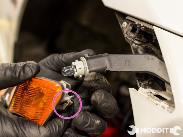 Note: Be sure to push in the bulb holder through the bumper so when removing the bumper, it won't be caught and rip. Do this on both sides.