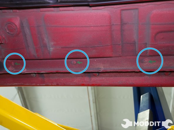 Following the removal of all the clips and bolts on the smaller oem undertray, one can easily remove it and put it to the side.