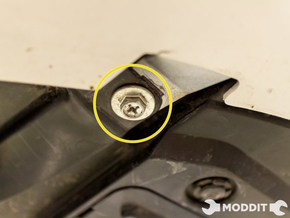 On the underside as well, remove the two bolts with a 10 mm socket. Surprisingly, these are actually the only two metal bolts on the underside.