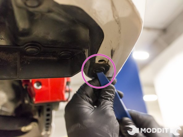 Under the bumper and car, remove seven plastic clips. These will be located around the perimeter of all the under panels.