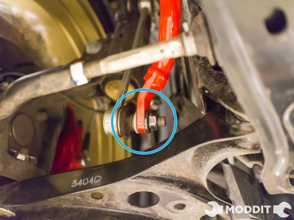 Hook the end links back onto the control arm. Torque the nuts down to spec, but make sure the stud does not spin while turning the nut.