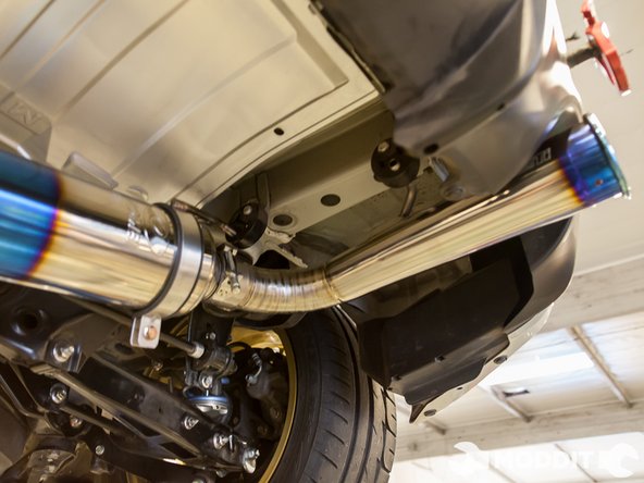 Note: Do not tighten the hanger completely as you will want to make adjustments later on to line up the tip of the exhaust.