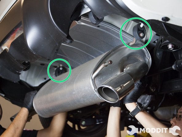Have a another person support the exhaust and proceed to remove the other 2 exhaust bushings