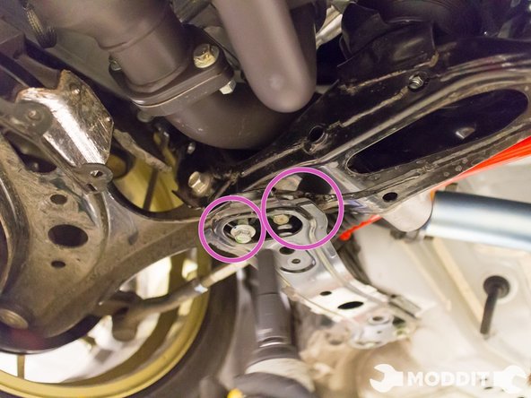 Beginning with the front-most bolt, secure the sub-frame mounting bracket to the actual front sub-frame.