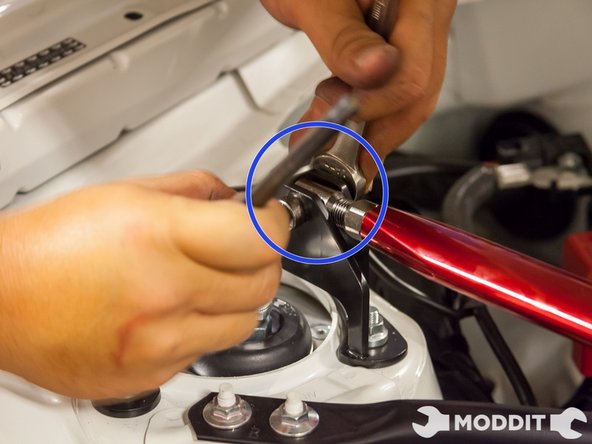 Once you feel every connection is properly lined up, continue to tighten the center section with the strutbar ends. Using the correct size Allen Key and Regular 14mm Wrench hand tighten  the two pieces together.