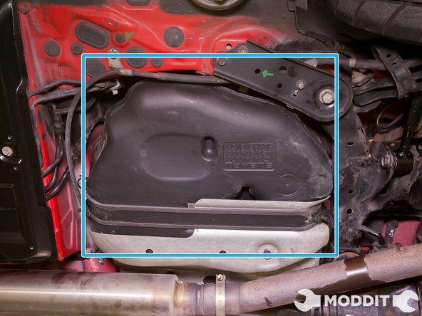 Next move on to the left/fuel tank under tray area. It is recommended you quickly mock up and loosely place the new panel below this area to get an idea of where it will go.