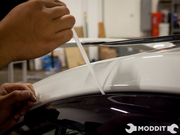 Removal of the tape backing officially installs the visors on the vehicle.