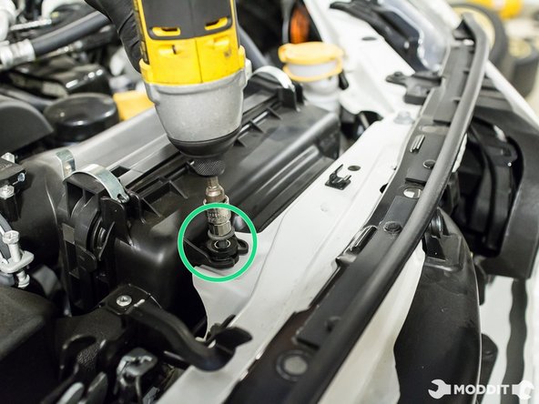 With the 10mm socket, remove the five bolts securing the stock intake, snorkel and box to the vehicle.