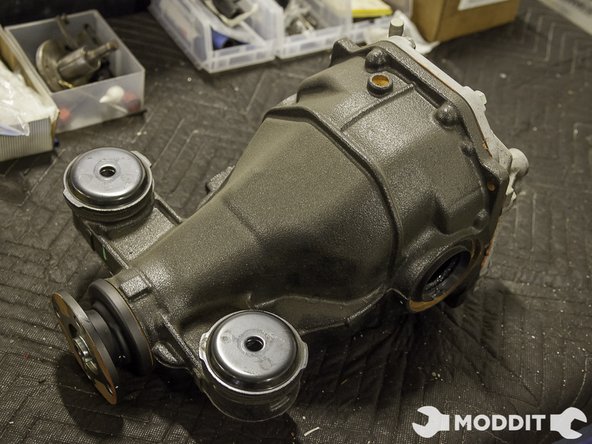 After you have the differential case out, set it down somewhere when you can easily work on it. A sturdy table top works great