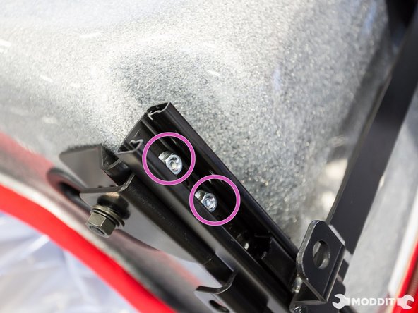 A 2nd pair of hands might be useful for this as to make sure that the rail is lined up properly on the holes of the side mount.