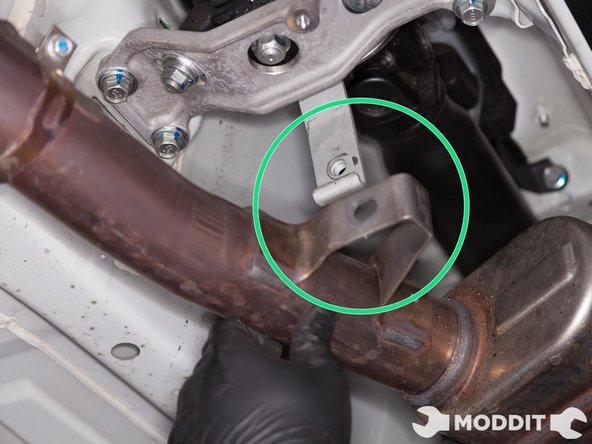 Remove front pipe from center bracket. Some pressure on the bracket may be required.