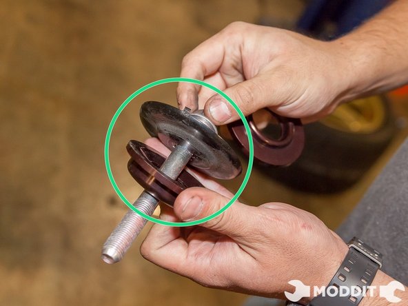 Using your ____ Socket, loosen the rear main bushing bolt from the body. This area is located right behind the exhaust muffler. Here after loosening the bolt we  posed how you should layout the collar bushings.
