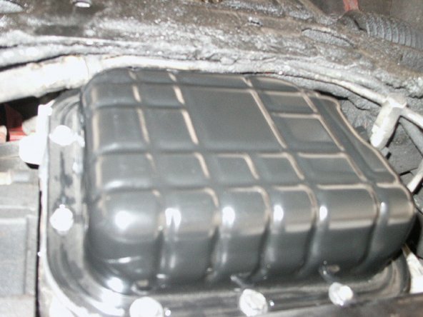 Place the new back on and tighten the 10 bolts in a criss-cross pattern until all tight.