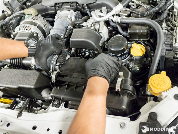 Slowly but surely remove the intake tube from the box.