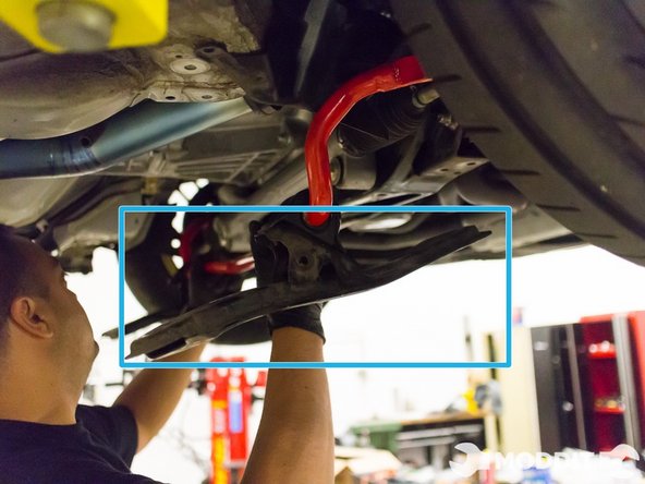 After the sub-frame mounts are bolted up, bring up the sway bar up to the mounting point in the car.