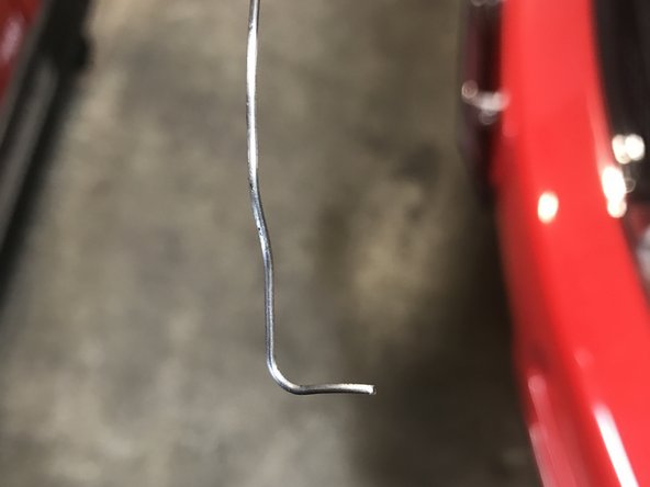 There are 2 types of tentioners. Newer shoe retainer and the older unit that will need safety wire to lock it in place. Compress The tensioner and Secure it in place.