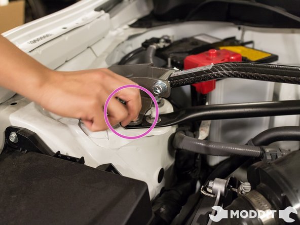 After placing the strut bar at the correct position, carefully and loosely finger thread the nuts on the stud. Make sure that they do not cross thread, or you will have a bad time.