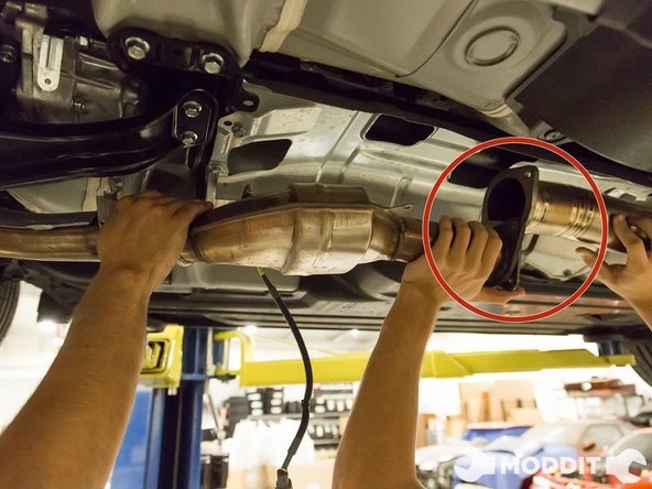 Remove the bolts holding the mid pipe and any associated gaskets