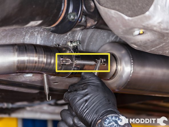 After making sure all the spring hooks line up, go ahead and install the springs. Make sure you're wearing eye protection. Use a needle nose plier or dikes to help you.