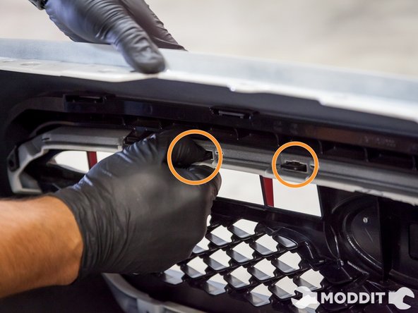 These tabs are very delicate and like to break when it is forced, so a nice and gentle use of the thumb will separate the tab from the bumper.