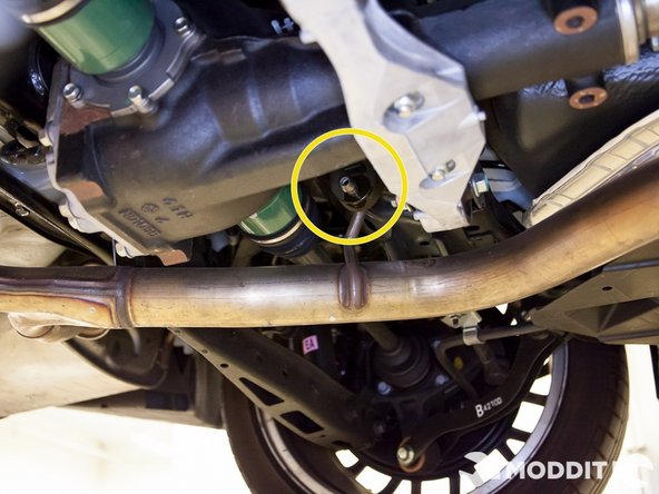 After the midpipe is unbolted, it is now time for your handy friend to hold the pipe for you as you remove it from the hanger.