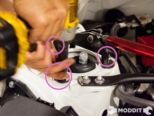 We began initially using a 12mm socket  and ratchet simply to make sure we didn't thread any oof the bolts that hold our critical suspension hardware.