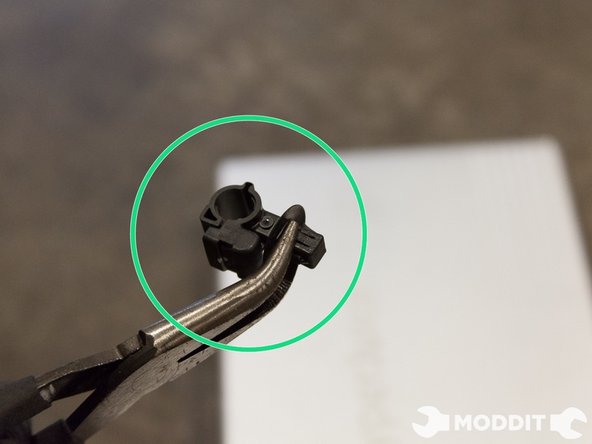 To remove the entire clip from the stock strut in order to reuse on the Stance coilovers,  we have to loosen a 4-way clip that is a completely tricky bastard, you have to pinch the larger two prongs, then the smaller two prongs at the same time to remove it.