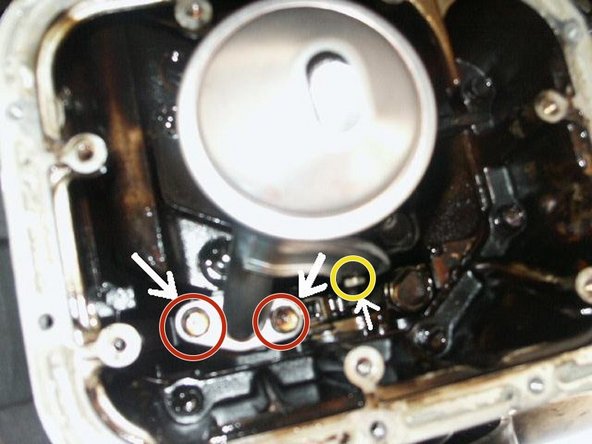 Replace gasket and install the 2 bolts using the 12mm socket.