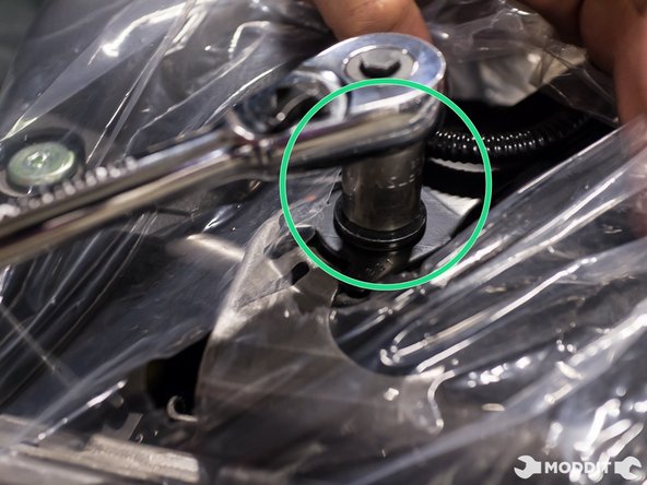 Remove the right head plastic cover nearest  the seatbelt buckle.