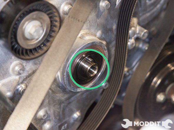 With all the pulleys loose, now remove each  one: the crank pulley, water pump pulley, alternator pulley and both idler pulleys.