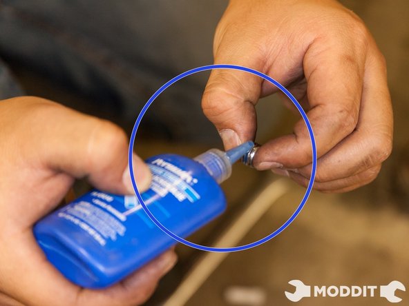 Apply blue thread locker to the set screw.