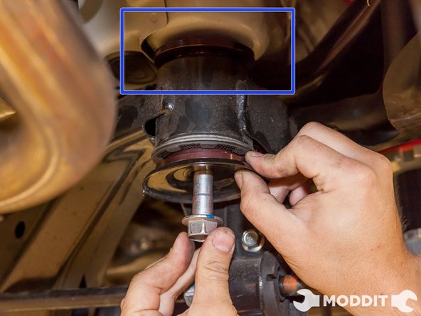 Because we had previously installed the Tomei Type-60R exhaust which has no muffler, our area to access the rear sub-frame bushing bolts was fairly open. Keep in mind you might have to remove the stock muffler if it is in your way.