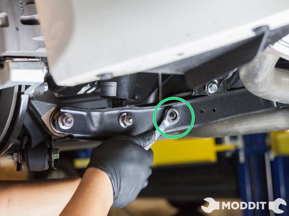 Then we disconnected the rear sway bar end link from the sway bar with a 14mm wrench and 6mm allen wrench to keep the end link from spinning.